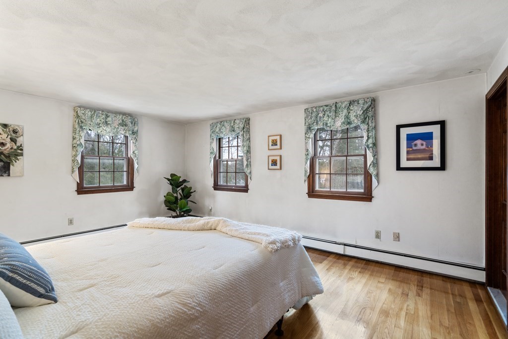 62 Rambling Road Sudbury, MA 01776 - Photo 20 of 38 a large bed sitting in a bedroom next to a window