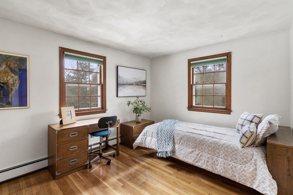 62 Rambling Road Sudbury, MA 01776 - Photo 22 of 38 a bedroom with a bed and a window