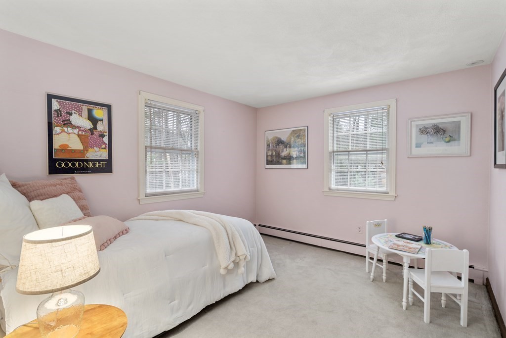 62 Rambling Road Sudbury, MA 01776 - Photo 24 of 38 a bedroom with a bed and a couch