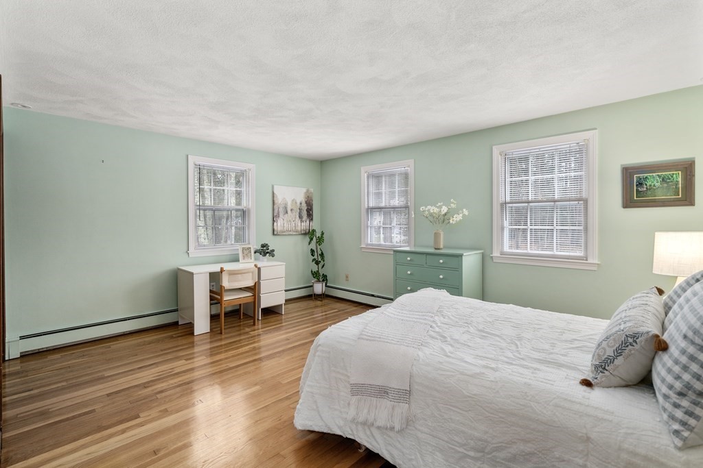 62 Rambling Road Sudbury, MA 01776 - Photo 25 of 38 a bedroom with a bed and a window