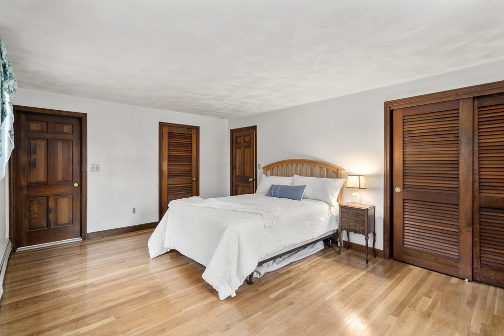 62 Rambling Road Sudbury, MA 01776 - Photo 27 of 38 a bedroom with a bed and a dresser