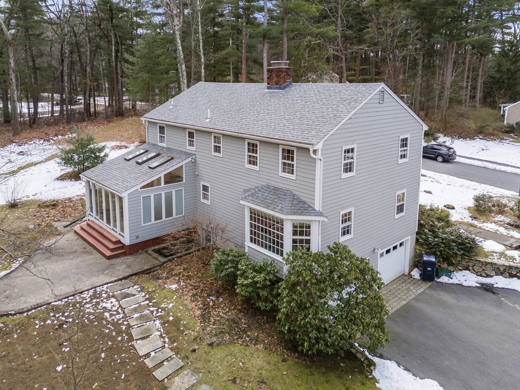 62 Rambling Road Sudbury, MA 01776 - Photo 3 of 38 a aerial view of a house with yard and a garden