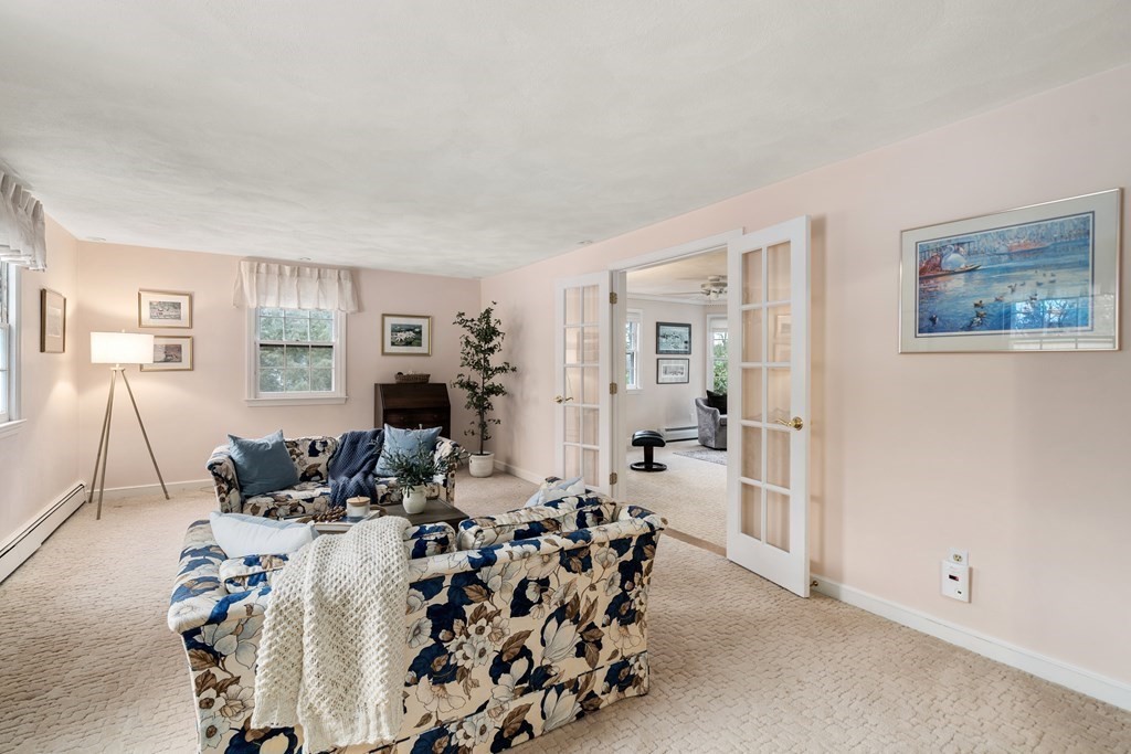 62 Rambling Road Sudbury, MA 01776 - Photo 7 of 38 a living room with furniture and a wooden floor