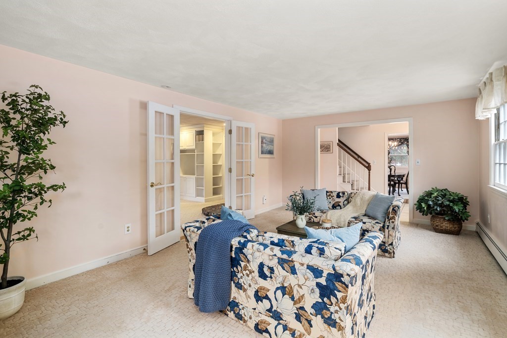 62 Rambling Road Sudbury, MA 01776 - Photo 8 of 38 a living room with furniture and flowers