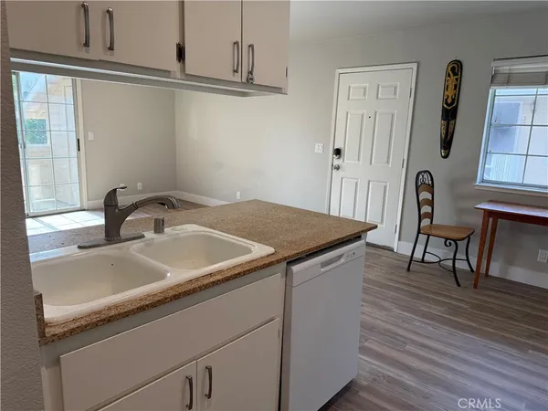 a view of a sink and a microwave