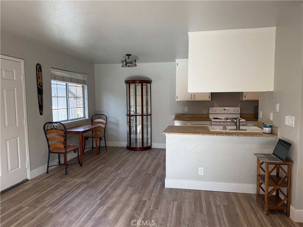 2055 Amanda, Unit 26 Chico, CA 95928 - Photo 13 of 15 a living room with granite countertop furniture a wooden floor and a sink