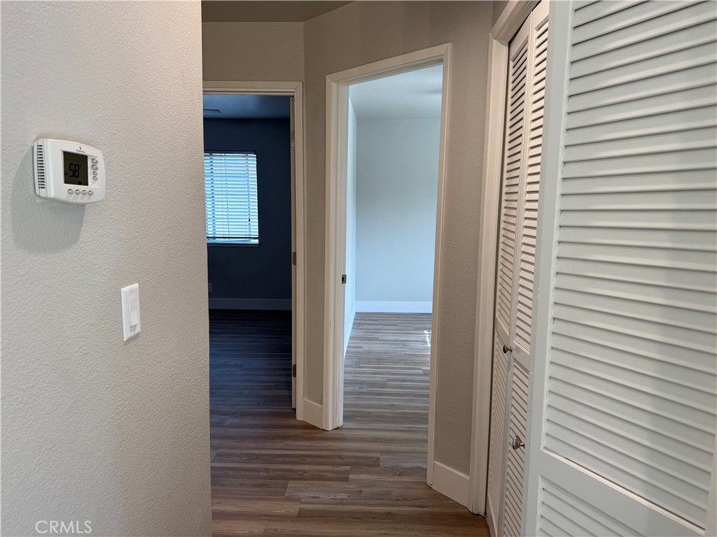 2055 Amanda, Unit 26 Chico, CA 95928 - Photo 8 of 15 a view of a hallway with wooden floor