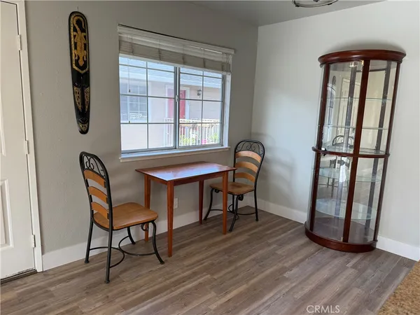 a view of a dining room with furniture and window
