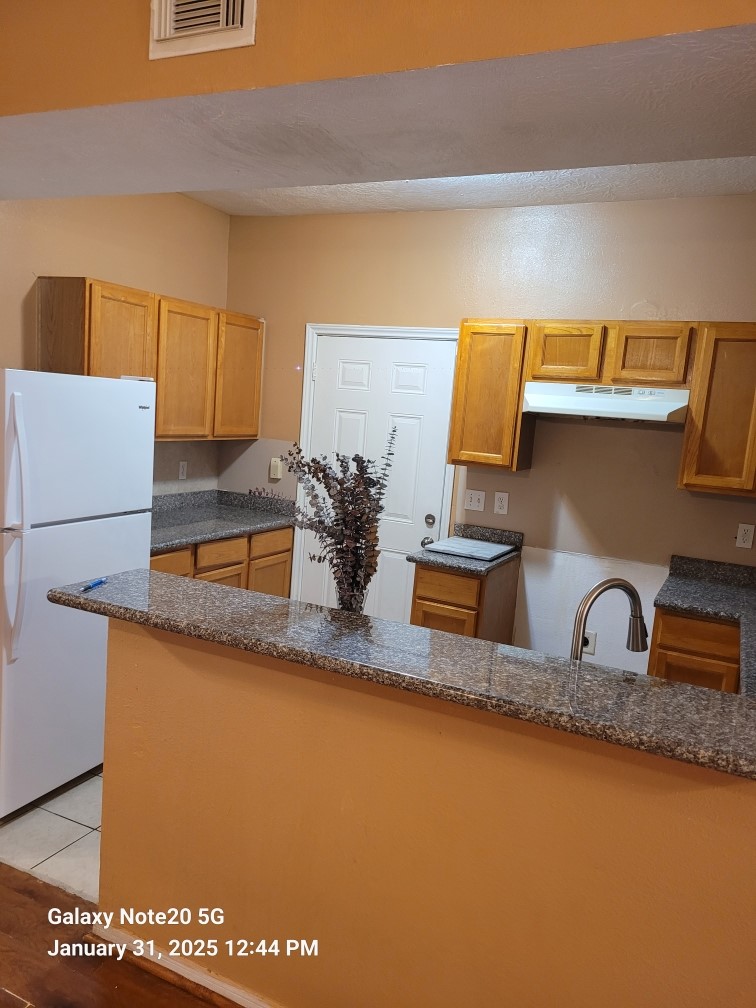 6934 Paris Street, Unit B Houston, TX 77021 - Photo 2 of 10 a kitchen with sink and cabinets