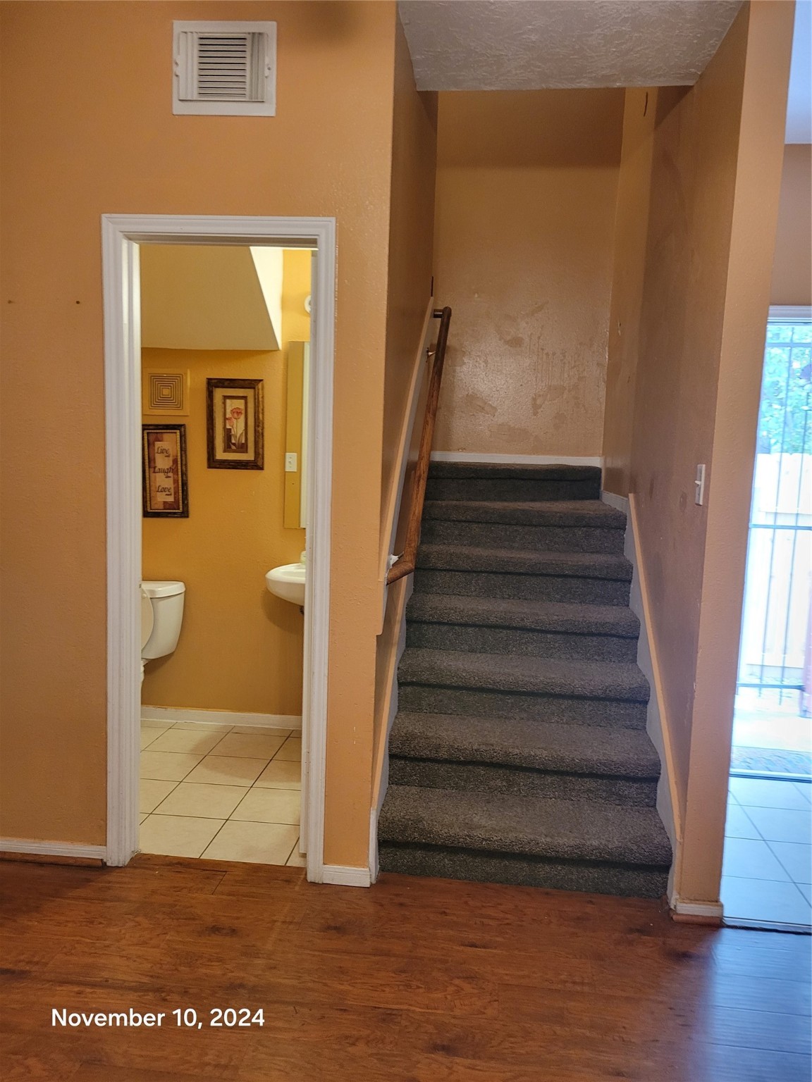 6934 Paris Street, Unit B Houston, TX 77021 - Photo 9 of 10 a view of a hallway with wooden floor and a living room