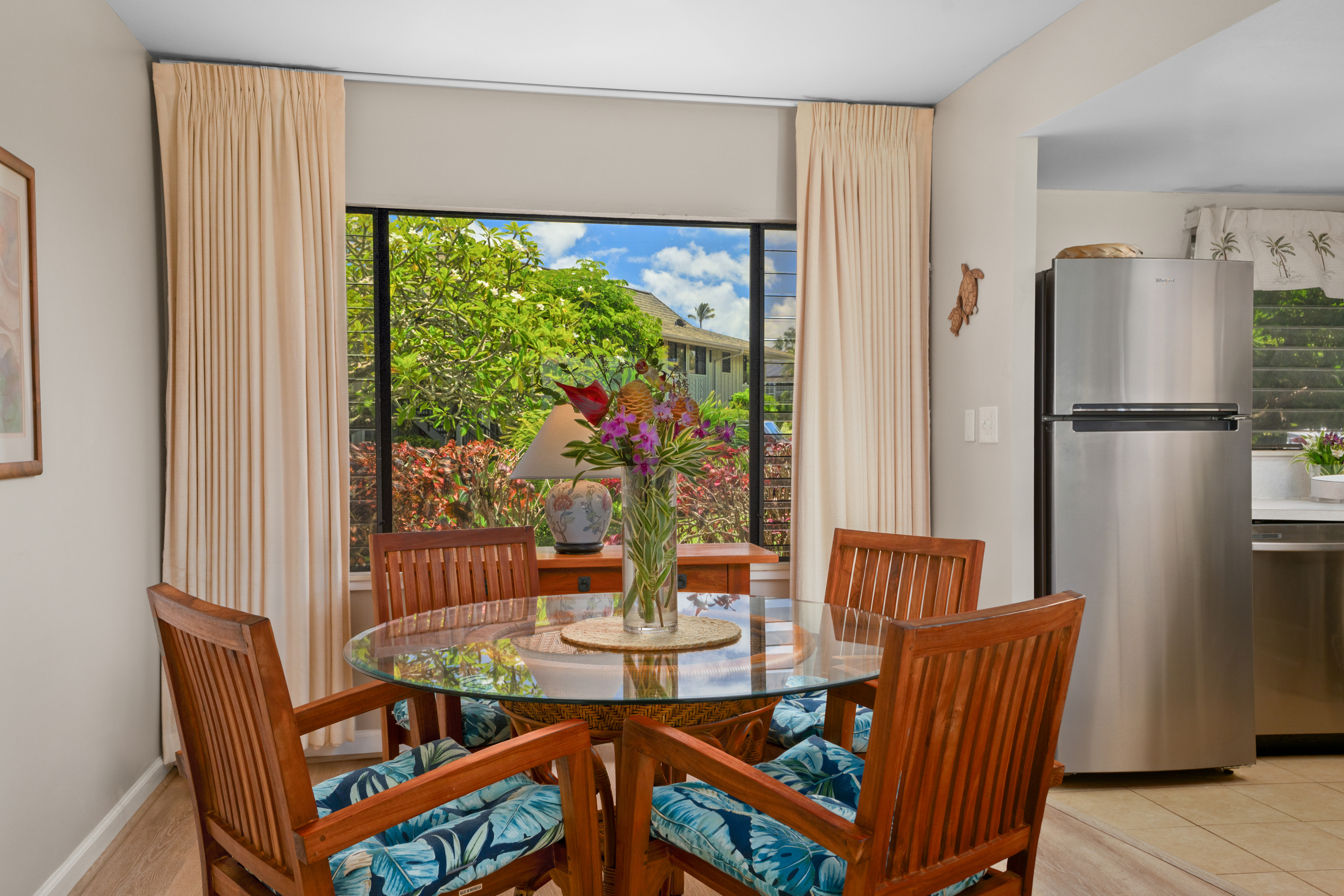 3830 Edward Road, Unit 12D Princeville, HI 96722 - Photo 12 of 30 a view of a dining room with furniture window and outside view
