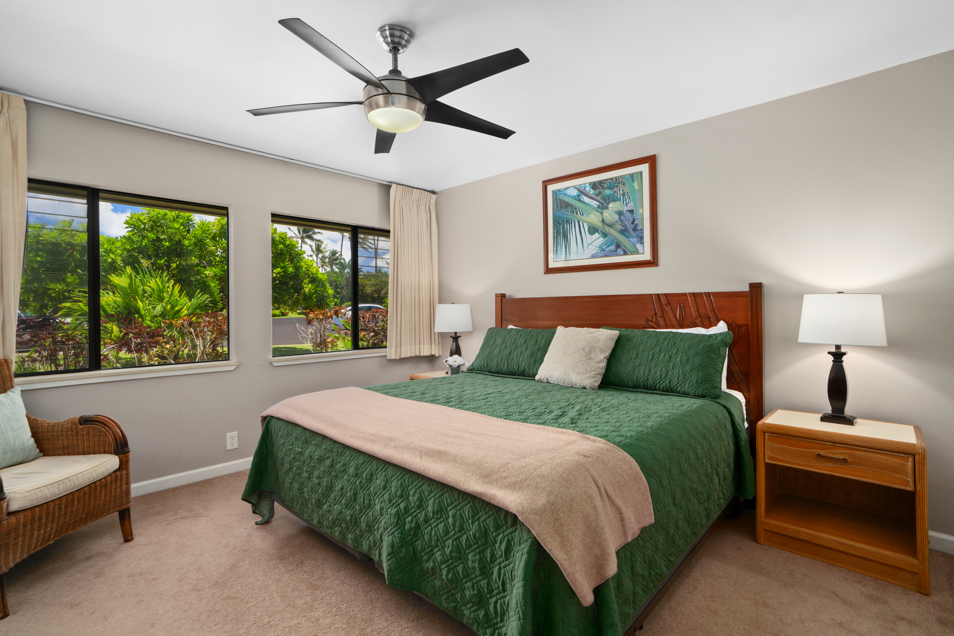 3830 Edward Road, Unit 12D Princeville, HI 96722 - Photo 13 of 30 a bedroom with a bed and a couch