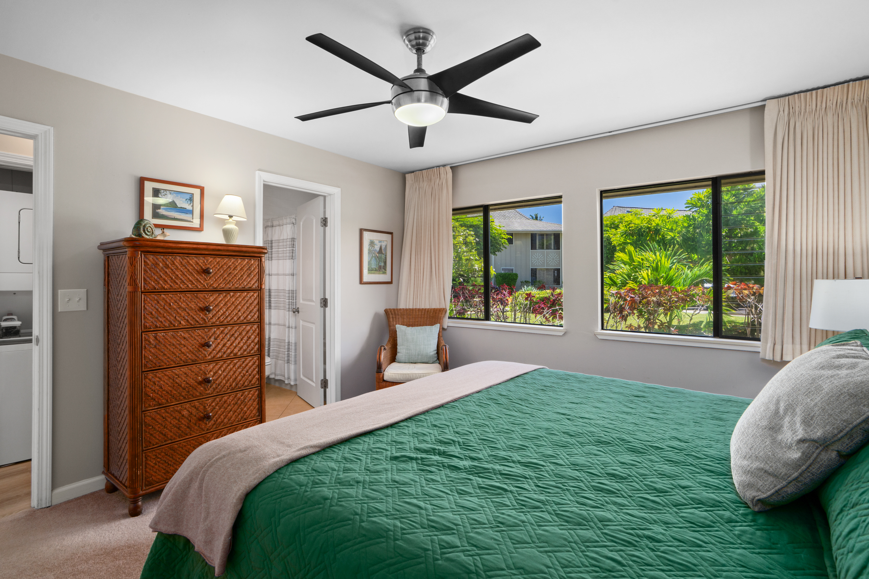 3830 Edward Road, Unit 12D Princeville, HI 96722 - Photo 14 of 30 a bed room with a bed and a large window