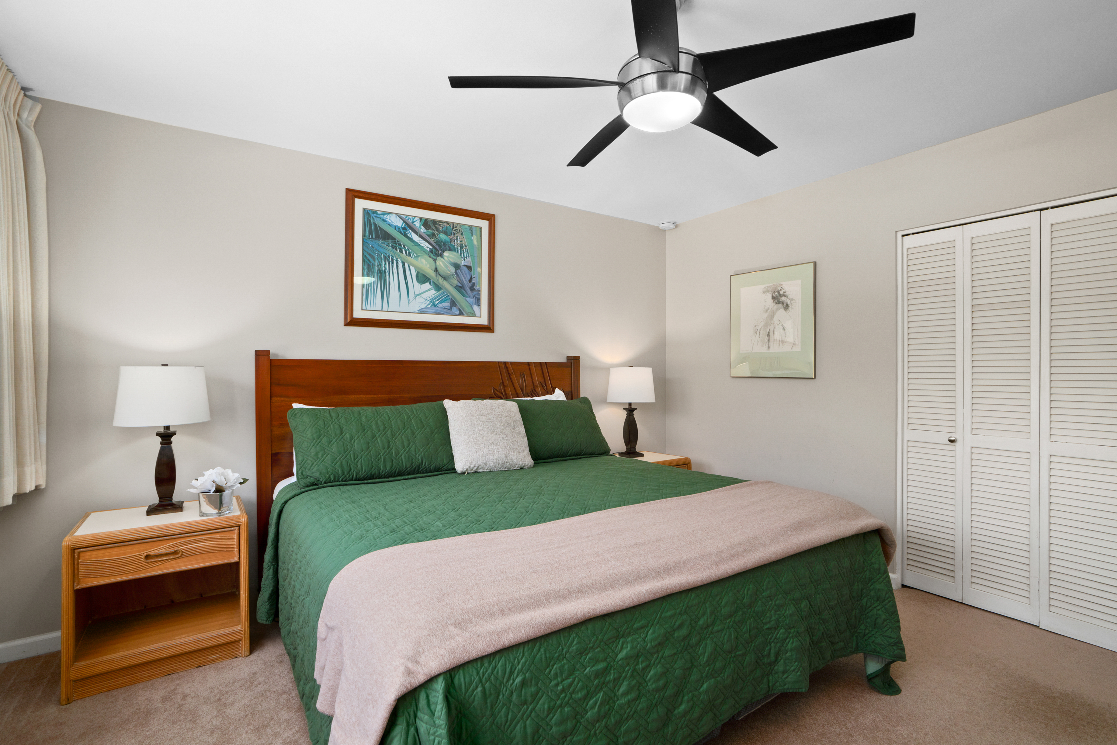 3830 Edward Road, Unit 12D Princeville, HI 96722 - Photo 15 of 30 a bedroom with a bed and a chair