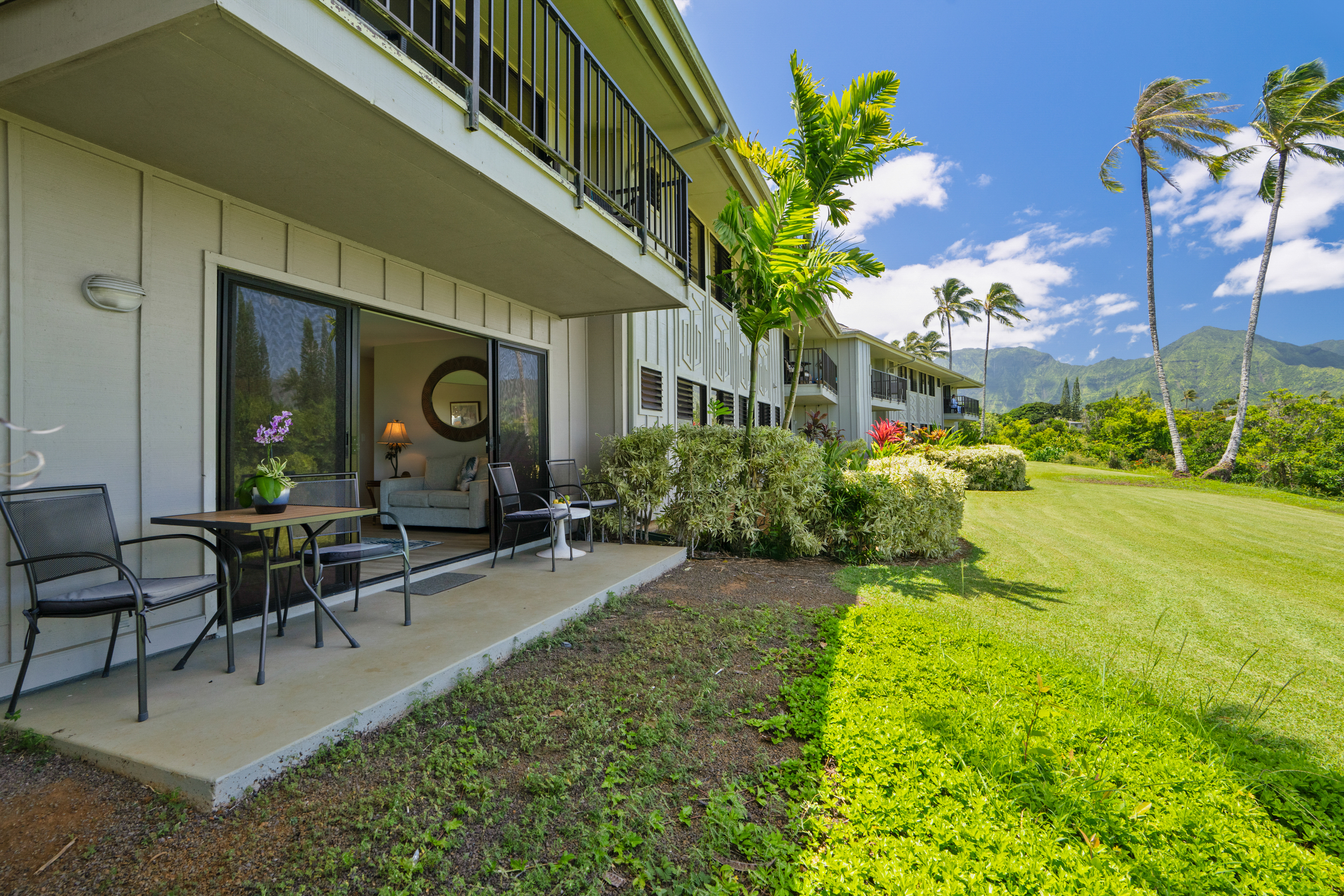 3830 Edward Road, Unit 12D Princeville, HI 96722 - Photo 22 of 30 a view of a house with backyard porch and sitting area
