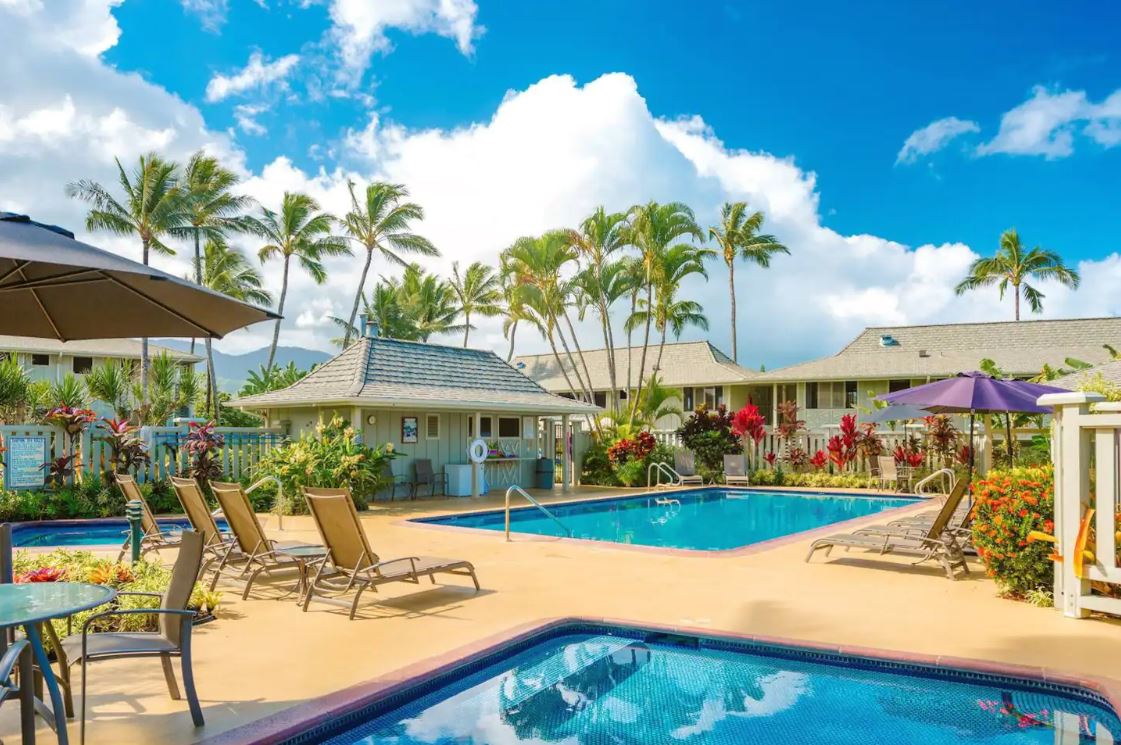 3830 Edward Road, Unit 12D Princeville, HI 96722 - Photo 28 of 30 a view of a swimming pool with outdoor seating