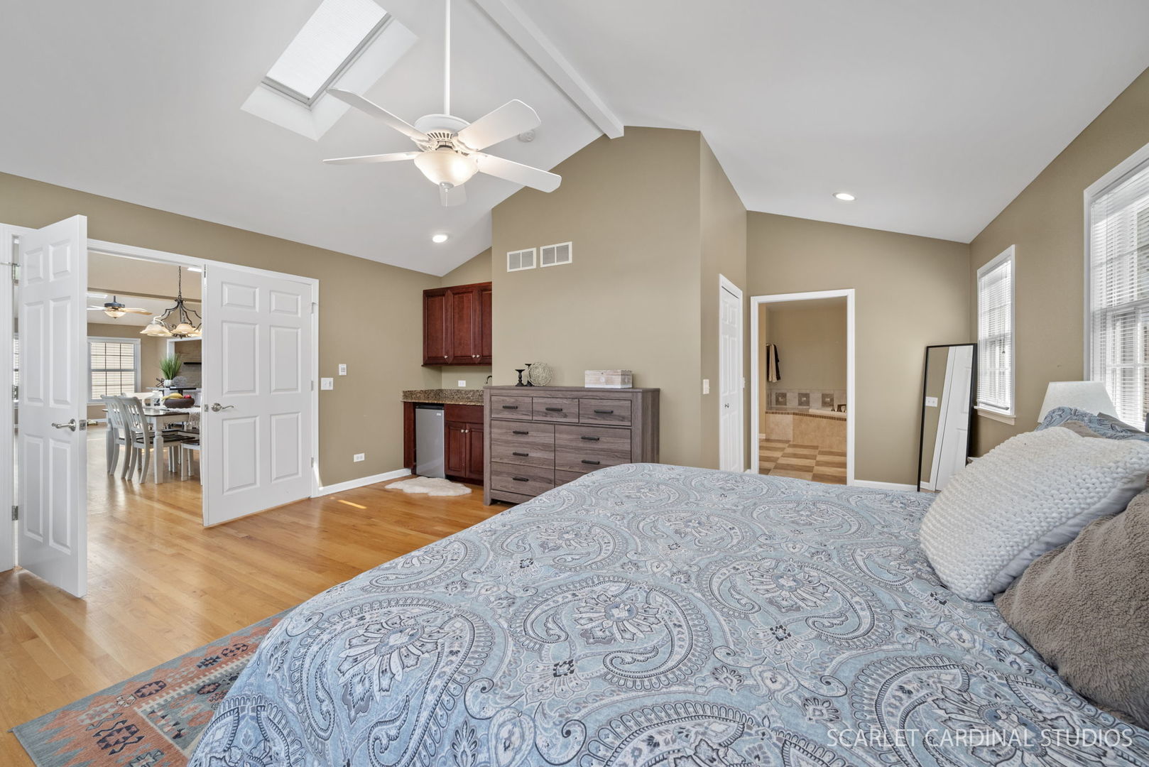 2S560 Seneca Drive Wheaton, IL 60189 - Photo 13 of 33 a large bedroom with a bed and a chandelier