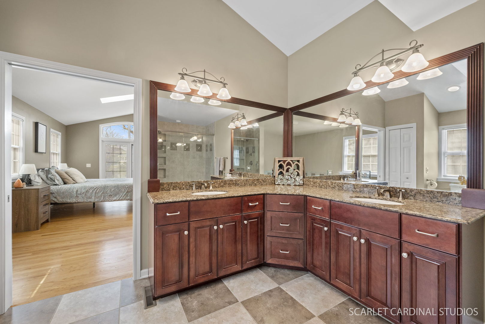 2S560 Seneca Drive Wheaton, IL 60189 - Photo 15 of 33 a spacious bathroom with a granite countertop sink a mirror and a bathtub