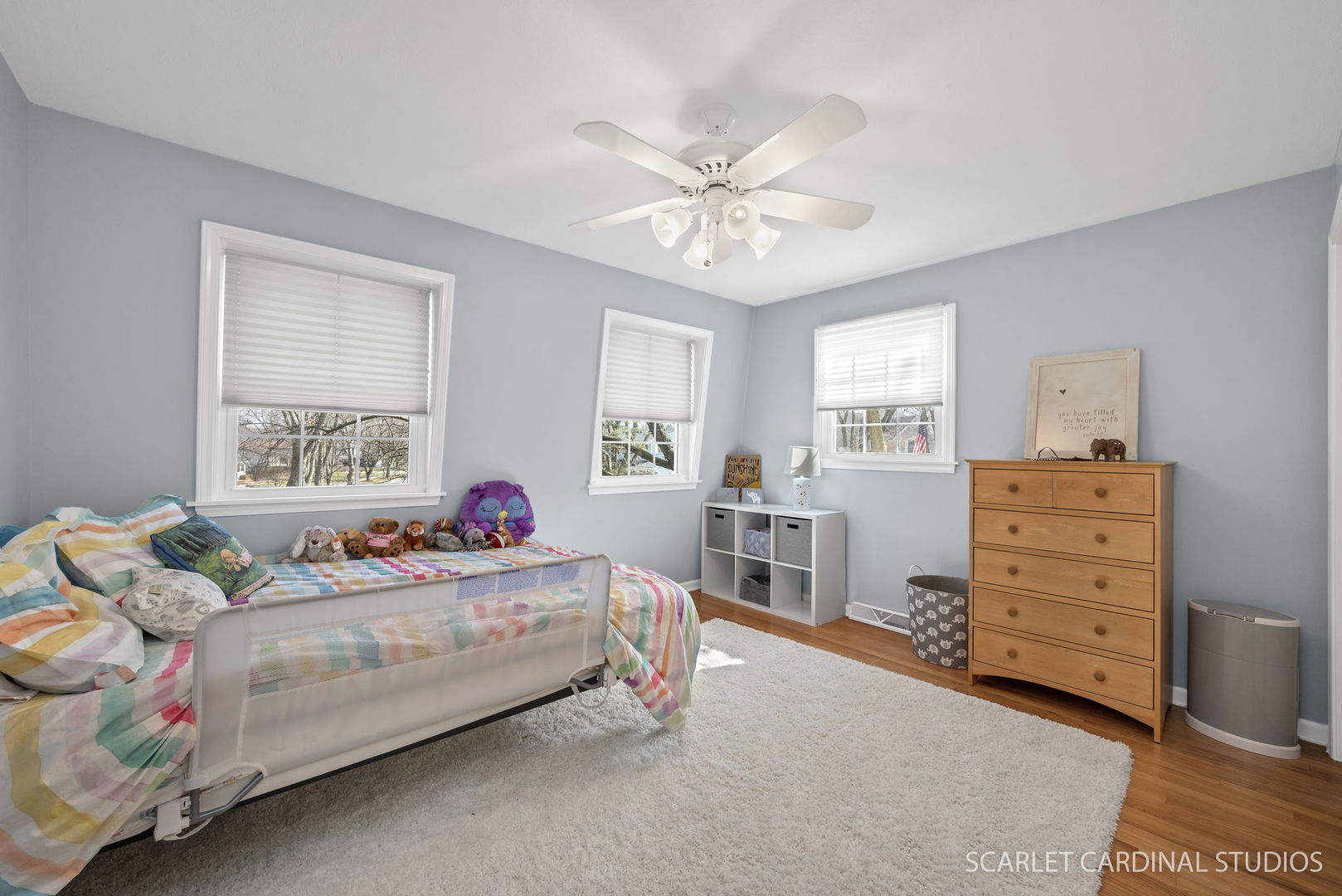 2S560 Seneca Drive Wheaton, IL 60189 - Photo 16 of 33 a bedroom with a bed and a chandelier