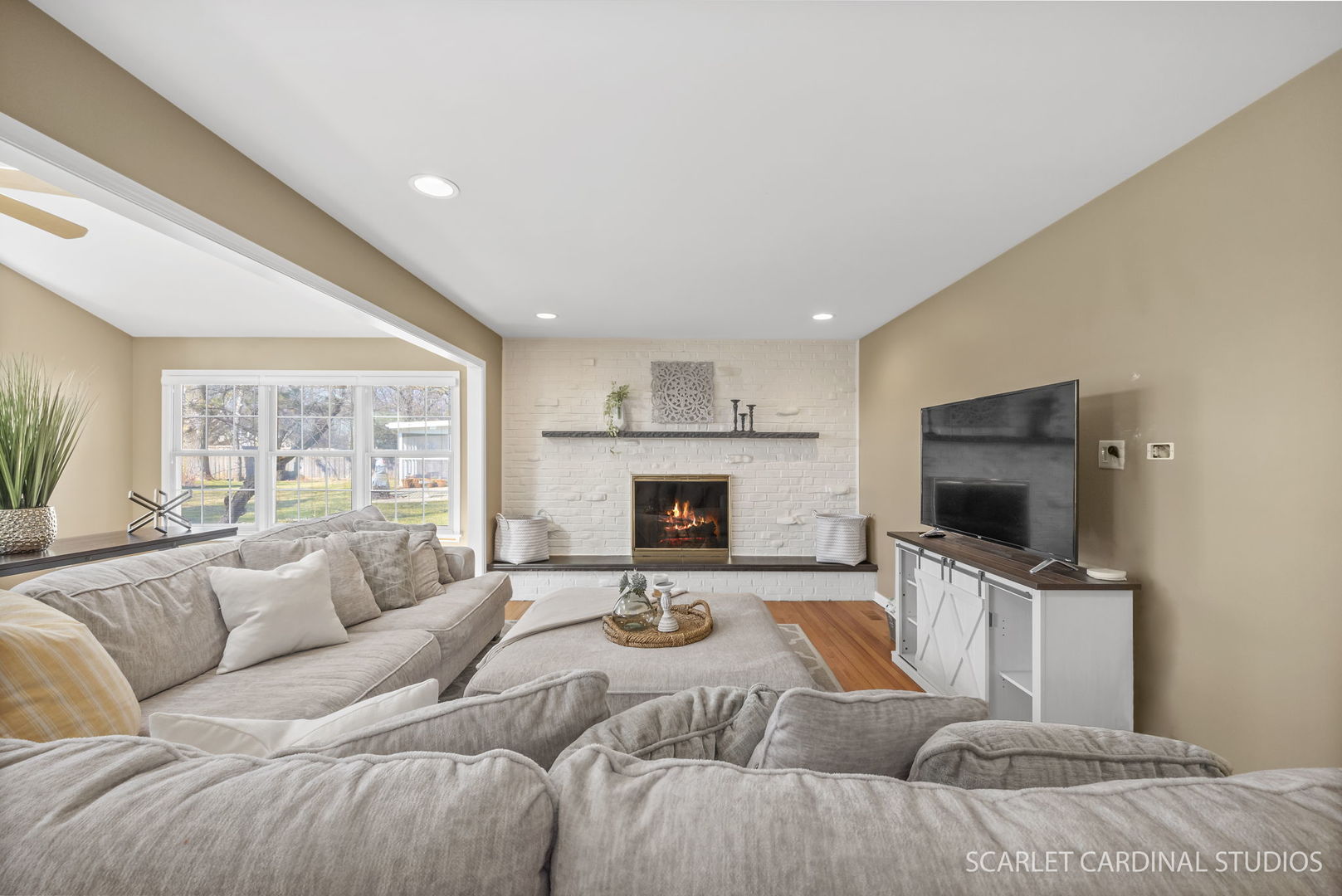 2S560 Seneca Drive Wheaton, IL 60189 - Photo 10 of 33 a living room with fireplace furniture and a flat screen tv