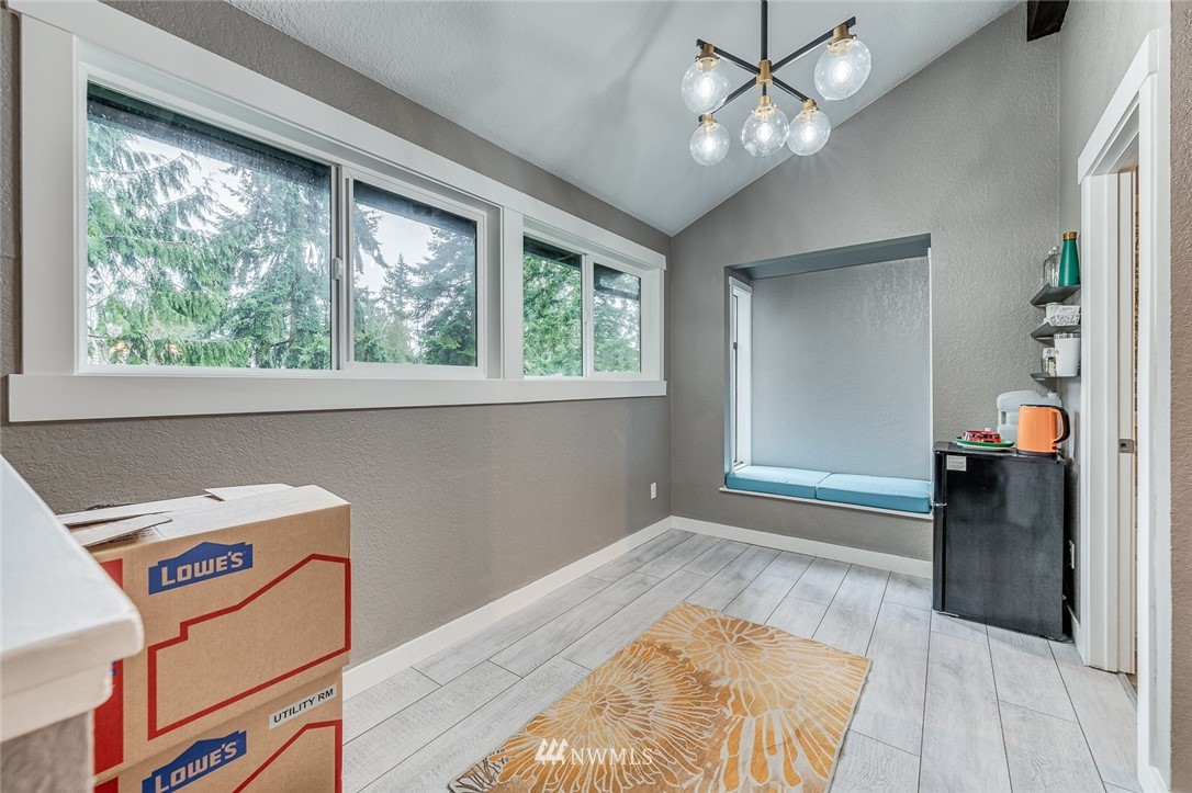 6918 Lower Ridge Road, Unit B Everett, WA 98203 - Photo 14 of 25 a view of a livingroom with wooden floor and a ceiling fan