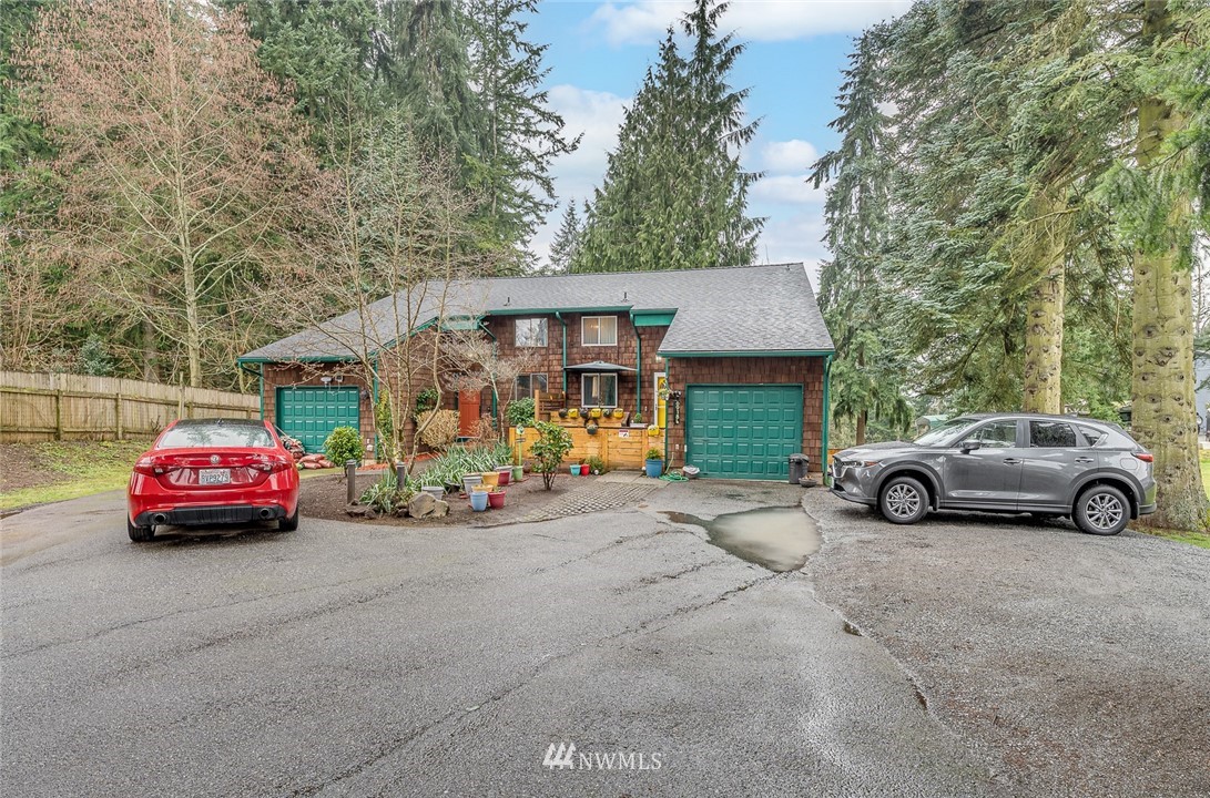 6918 Lower Ridge Road, Unit B Everett, WA 98203 - Photo 3 of 25 a view of street with parked cars