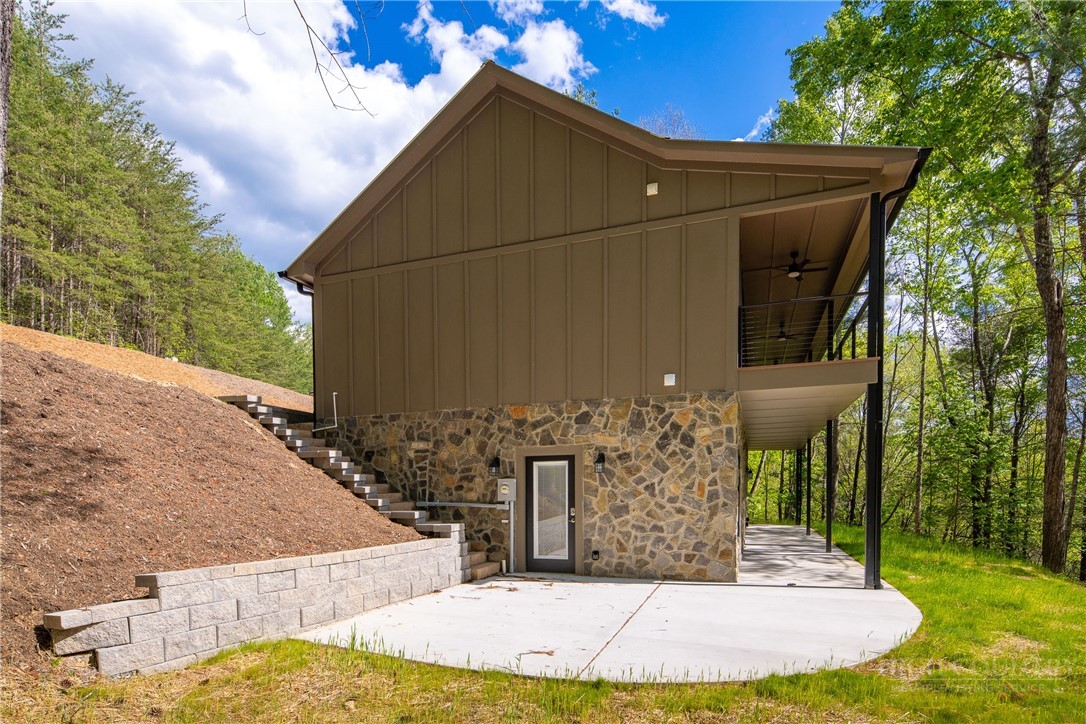 114 Woodpecker Road Purlear, NC 28665 - Photo 31 of 47 a view of a house with a small yard