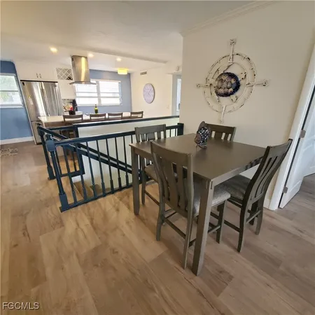 a bedroom with furniture and a flat screen tv