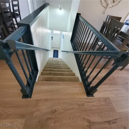 a view of a hallway with furniture