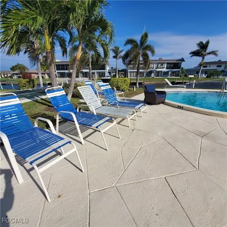 a view of a patio with swimming pool