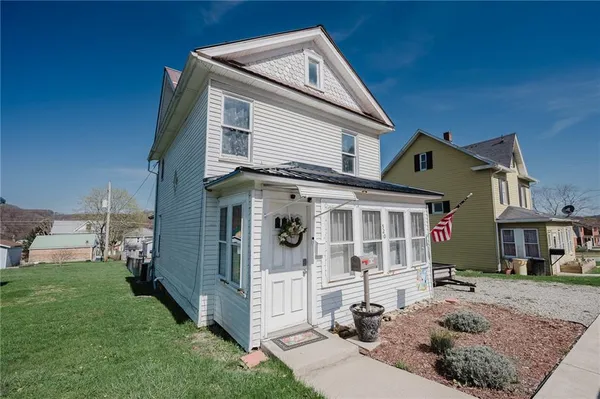 a front view of a house with a yard