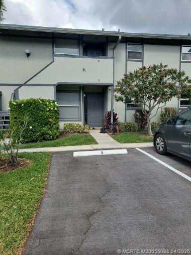 8227 Southeast Croft Circle Hobe Sound, FL 33455 - Photo 1 of 18 a house view with a garden space