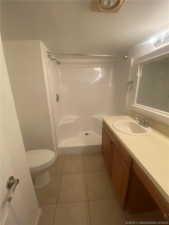 8227 Southeast Croft Circle Hobe Sound, FL 33455 - Photo 13 of 18 a bathroom with a sink a toilet and shower