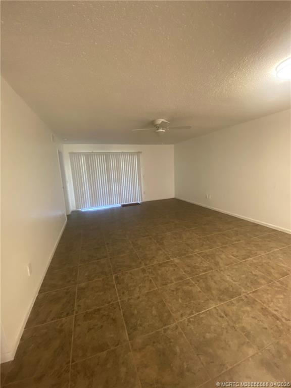 8227 Southeast Croft Circle Hobe Sound, FL 33455 - Photo 7 of 18 en empty room with windows