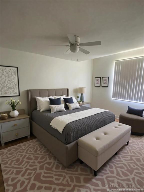8227 Southeast Croft Circle Hobe Sound, FL 33455 - Photo 9 of 18 a bedroom with furniture and a couch