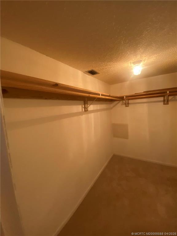 8227 Southeast Croft Circle Hobe Sound, FL 33455 - Photo 10 of 18 a view of a room with racks on the wall