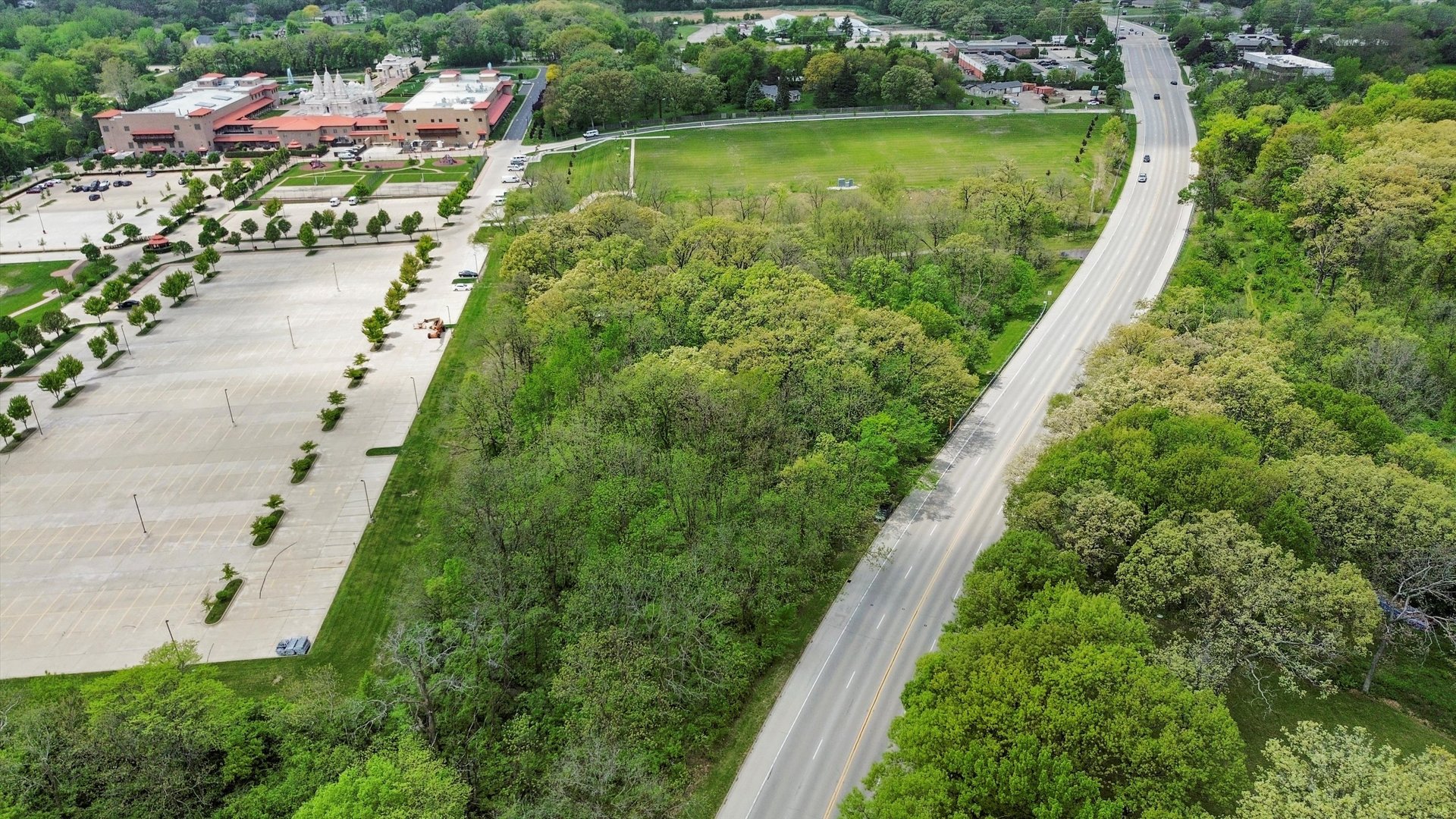 29W725 Army Trail Road West Chicago, IL 60185 - Photo 5 of 11 an aerial view of a house with a garden and swimming pool