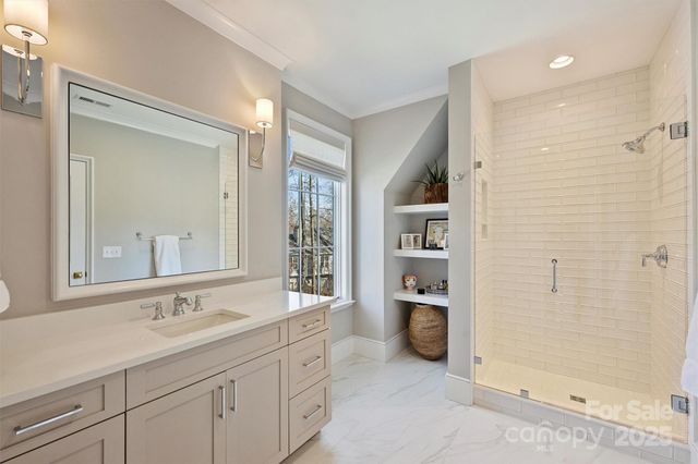 a bathroom with a granite countertop sink mirror and double