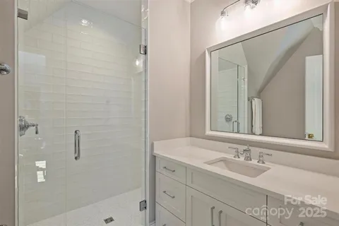 a bathroom with a bathtub a sink and a mirror