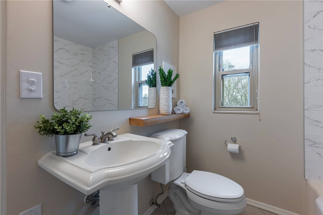 1012 Hampshire Road Dayton, OH 45419 - Photo 22 of 39 This bright bathroom features a pedestal sink and natural light.