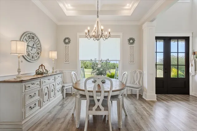 a view of a dining room furniture and wooden floor