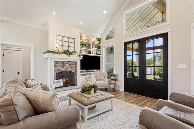 a living room with furniture fireplace and a flat screen tv