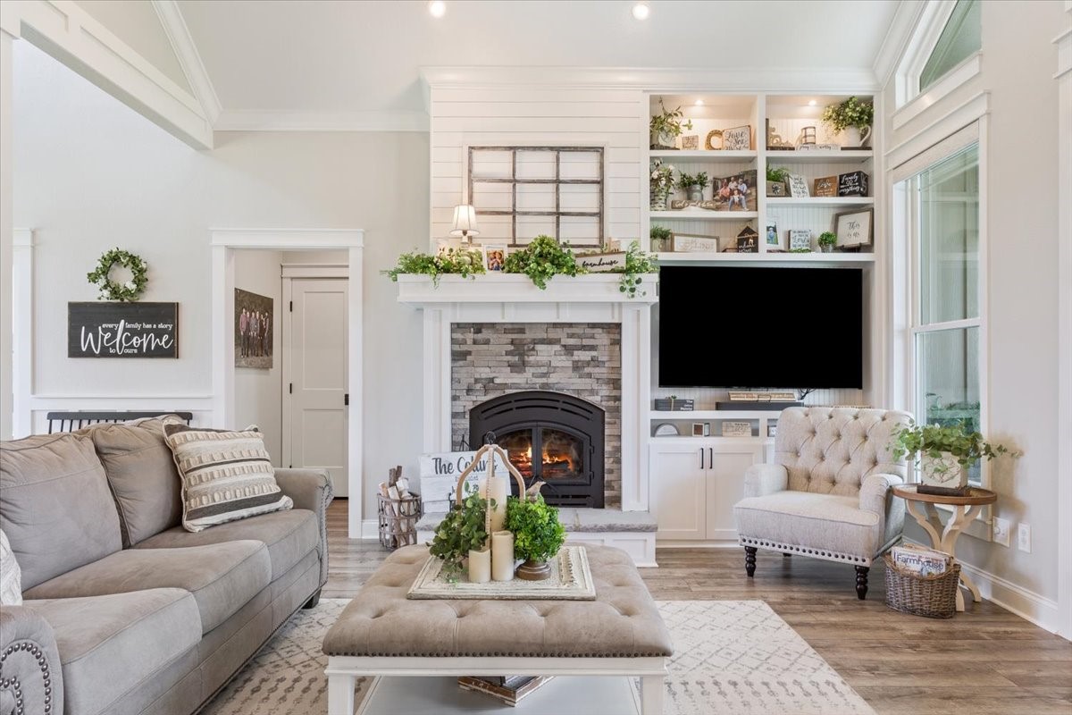 710 Lcr 800 Groesbeck, TX 76642 - Photo 14 of 47 a living room with furniture a flat screen tv and a fireplace