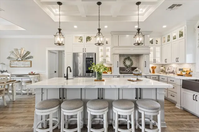 a kitchen with a center island and cabinets
