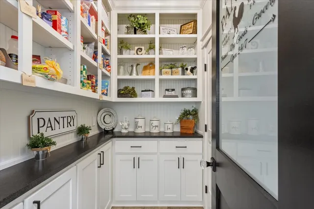 a kitchen with a cabinets and window