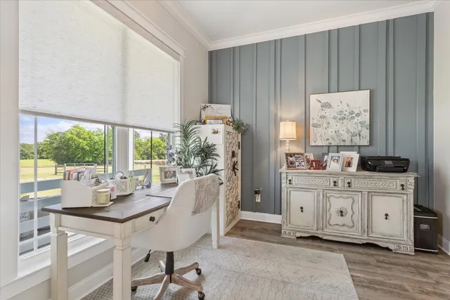 a very nice looking dining room with a large window and dining table