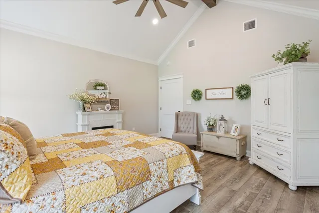 a bedroom with a bed and a dresser