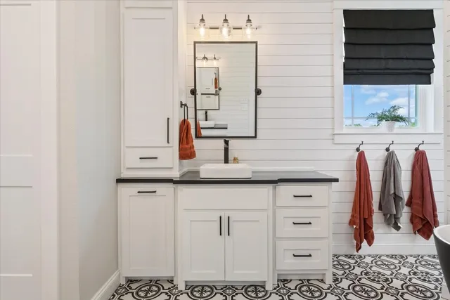 a bathroom with a sink and a mirror