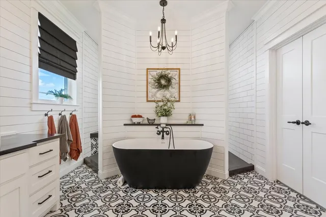 a bathroom with a sink and a window