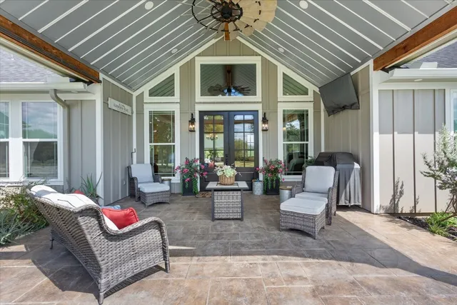 a outdoor living space with furniture and a potted plant